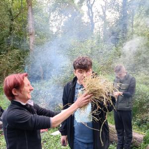 Forest Crew Making Fire With Straw